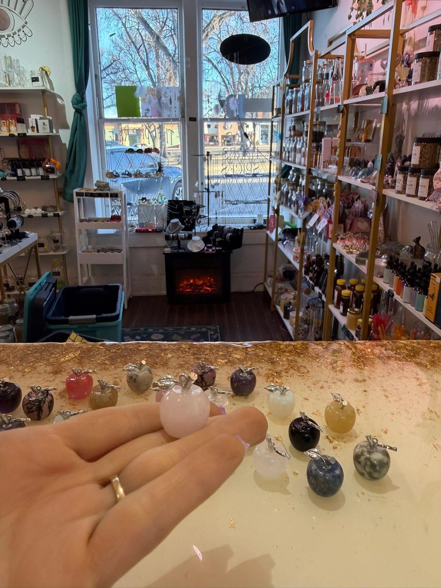 Inside The Spice Rack, with a fireplace, jewelry counter, and view of Bridge Street through the front window